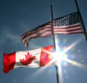 Canadian and American flags, side by side