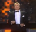 Dolph Lundgren singing in a tuxedo