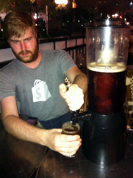 Brian alkerton pulls a beer