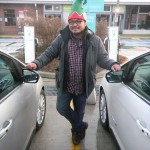 Rannie Turingan standing between two Ford C-MAX cars