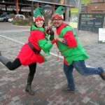Sara Mercier and Rannie Turingan in elf costumes, striking a Busby Berkely dancing pose