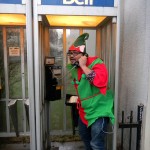 Rannie Turingan in an elf costume in a pay phone