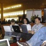 Aaron Swartz and Wes Felter, deep in their laptops at the conference hotel lobby.