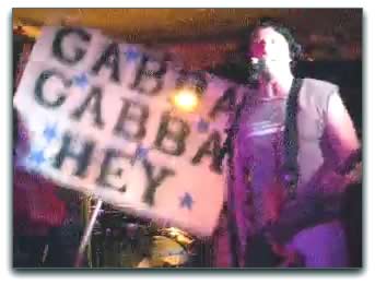 Still from the video of the Ramoniacs' version of 'Pinhead', featuring Joey deVilla as the Pinhead.