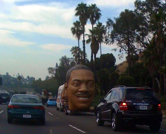 Eddie Murphy's head rolling down a California highway