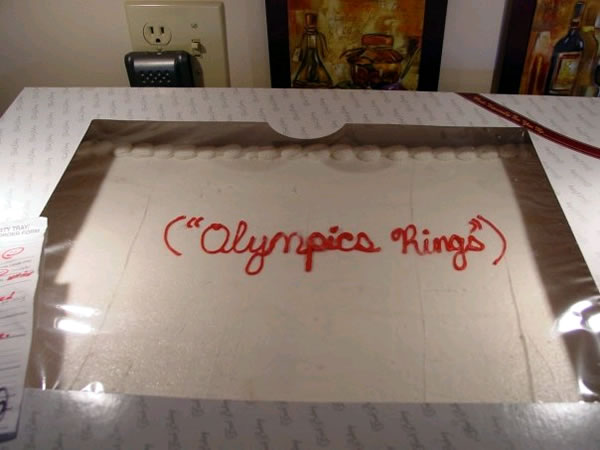 Cake with the text "Olympics Rings" Cake with the text "Olympics Rings"