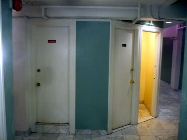 11. Bathrooms in the 11th floor hallway at Hotel Cecil