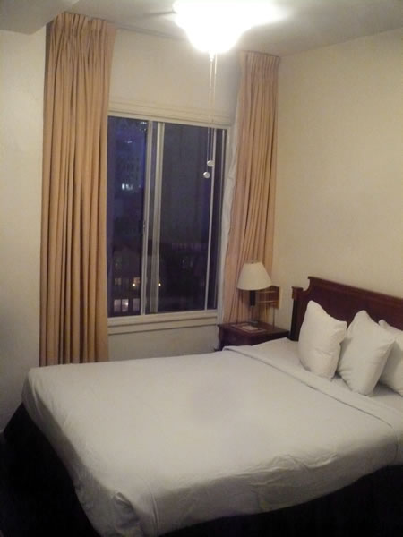 17. The bed and window in my room at Hotel Cecil