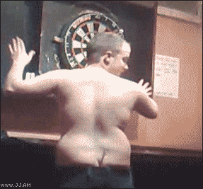 Shirtless guy with a dart down his buttcrack does a sexy dance by the dartboard and gets a dart int he side of his head