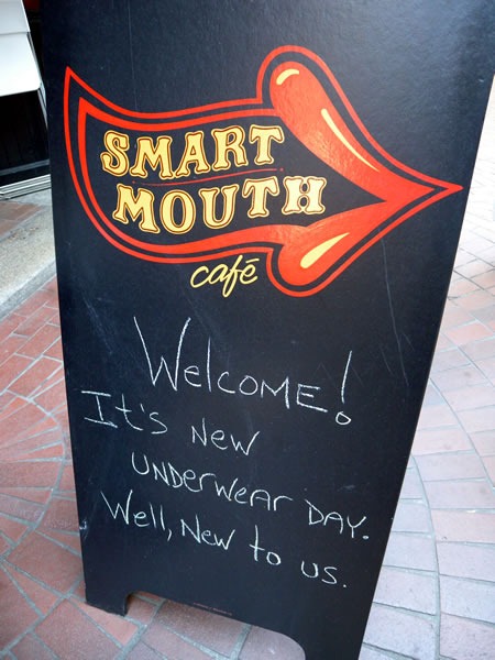 Chalkboard sign outside Smart Mouth Cafe: "Welcome! It's new underwear day! Well, new to us."
