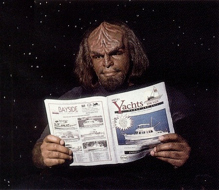 Michale Dorn ("Worf") reads "Yachts for Sale" magazine