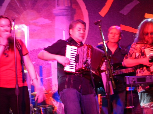 Joey deVilla playing accordion with Dayna, Jason and Botielus from 3 Digit IQ at Cabo Wabo Vegas