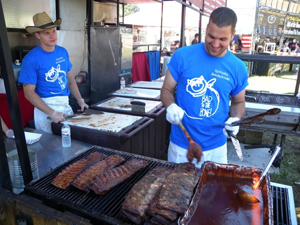 Ribbers preparing ribs on the grill at Kentucky Smokehouse