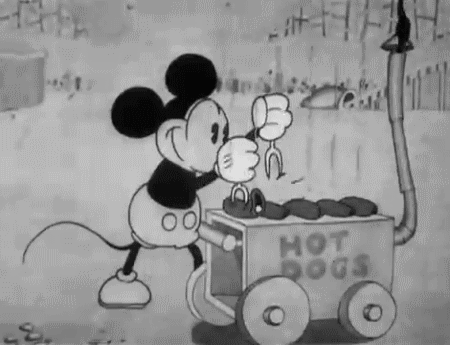 Animation of Mickey Mouse poking sausages with forks