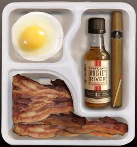 A tv-dinner style tray containing a poached egg, a lot of bacon, a small bottle of whiskey and a cigar and match