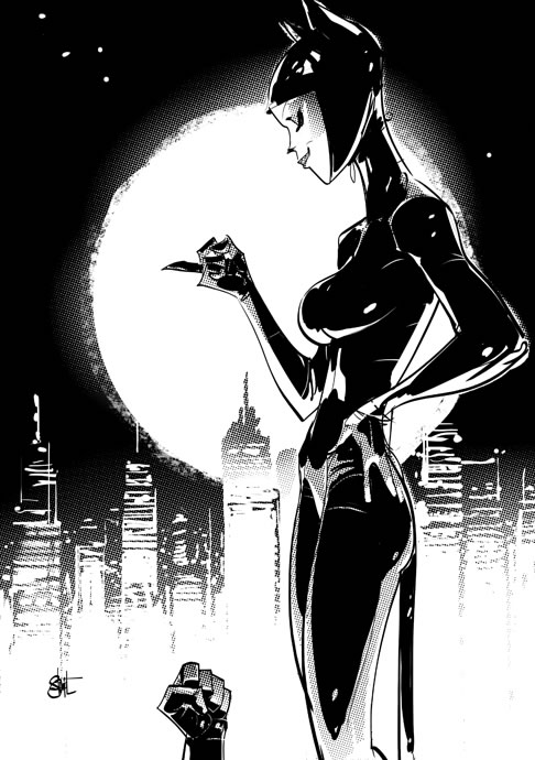 Comic panel: Catwoman standing, looking at her fist, quite pleased. A glove can be seen rising from the bottom of the panel, presumably from a prone Batman.