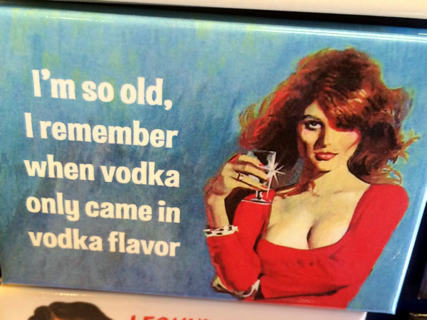 Refrigerator magnet featuring painting of sultry woman holding a martini glass with the text "I'm so old, I remember when vodka only came in vodka flavor". 