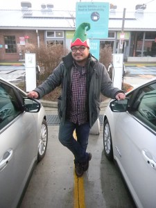 Rannie Turingan standing between two Ford C-MAX cars