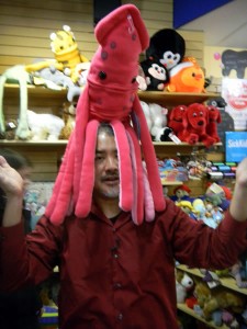 Joey deVilla poses with a plush squid on his head
