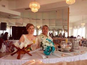Anitra Pavka and Joey deVilla at the bridal table at their wedding.