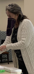 Photo: Woman wearing a Crown Royal bag as a mask