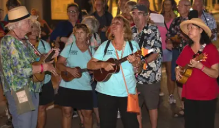 "Strum and stroll" ukulele players playing on Cleveland Street in Downtown Clearwater.