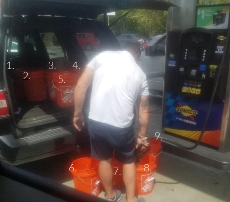 Man at gas station filling 9 Home Depot buckets with gasoline