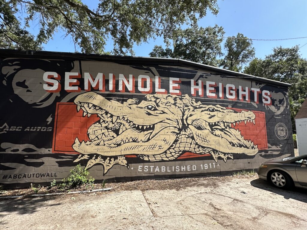 A “Seminole Heights - established 1911” mural, featuring the two-headed alligator named “Bite or Smite.”