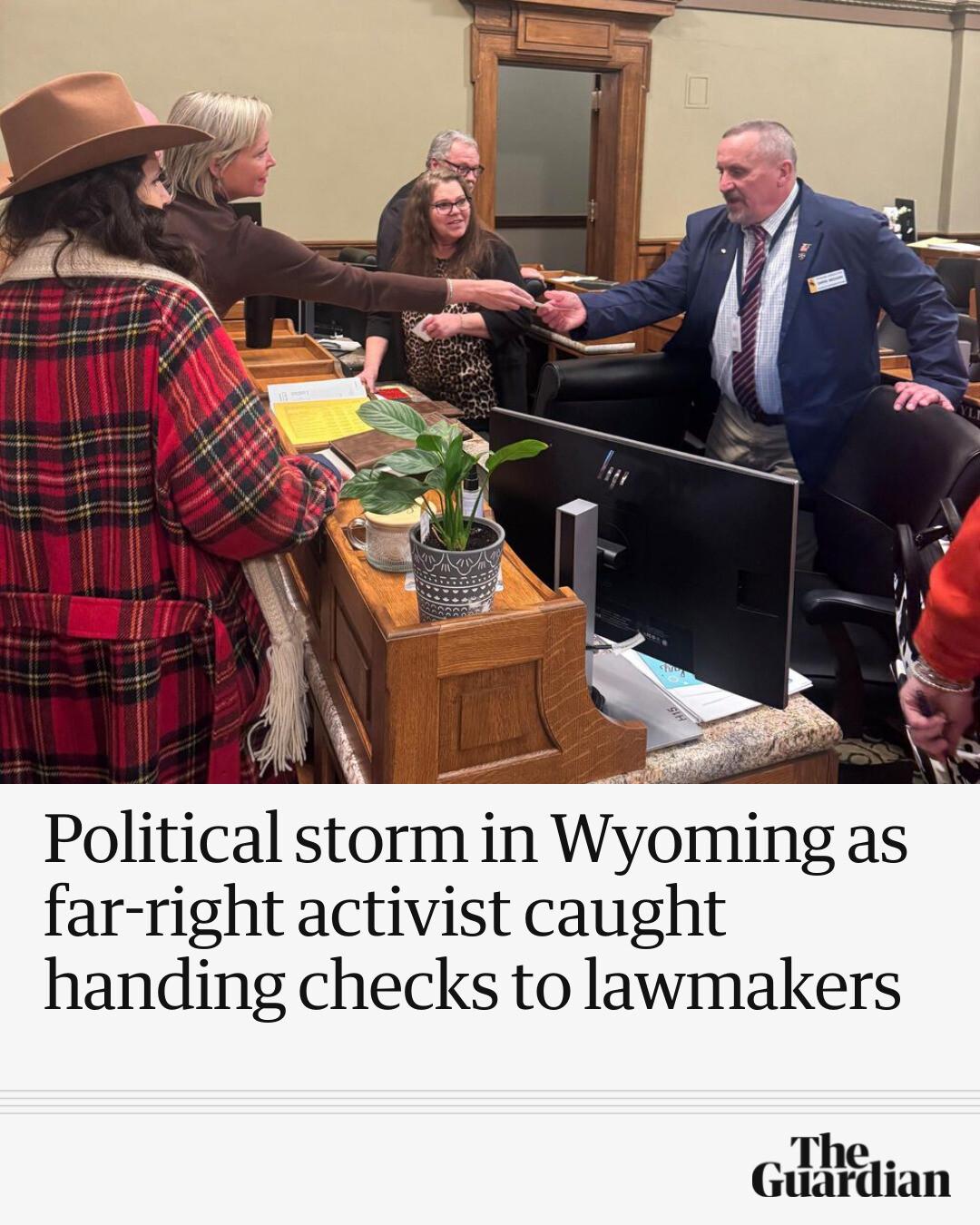 far-right-activist-handing-checks-to-lawmakers